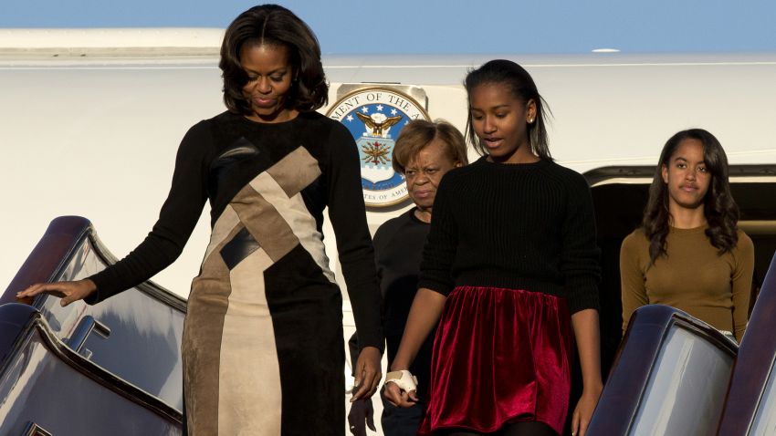 BEIJING, CHINA - MARCH 20:  First Lady Michelle Obama with her mother Marian Robinson, daughters Sasha Obama and Malia Obama arrives at Beijing Capital International Airport on March 20, 2014 in Beijing, China. The first lady arrived in Beijing with her mother, Marian Robinson, and daughters to kick off a six-day tour where she will focus on education and cultural exchange. (Photo by Alexander F. Yuan/Getty Images)