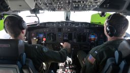 In this undated photo provided by the Navy Visual News Service, Lt. j.g. Kyle Atakturk, left, and Lt. j.g. Nicholas Horton, naval aviators assigned to Patrol Squadron (VP) 16, pilot a P-8A Poseidon during a mission to assist in search and rescue operations for Malaysia Airlines flight MH370 on March 19, 2014 over the Indian Ocean.