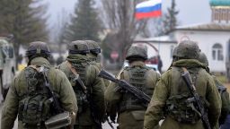 Russian soldiers patrol the area surrounding the Ukrainian military unit in Perevalnoye, outside Simferopol, on March 20, 2014. Kiev will never recognise Russia's annexation of Crimea and will fight for the 'liberation' of the strategic Black Sea peninsula, Ukraine's parliament said in a resolution adopted on March 20
