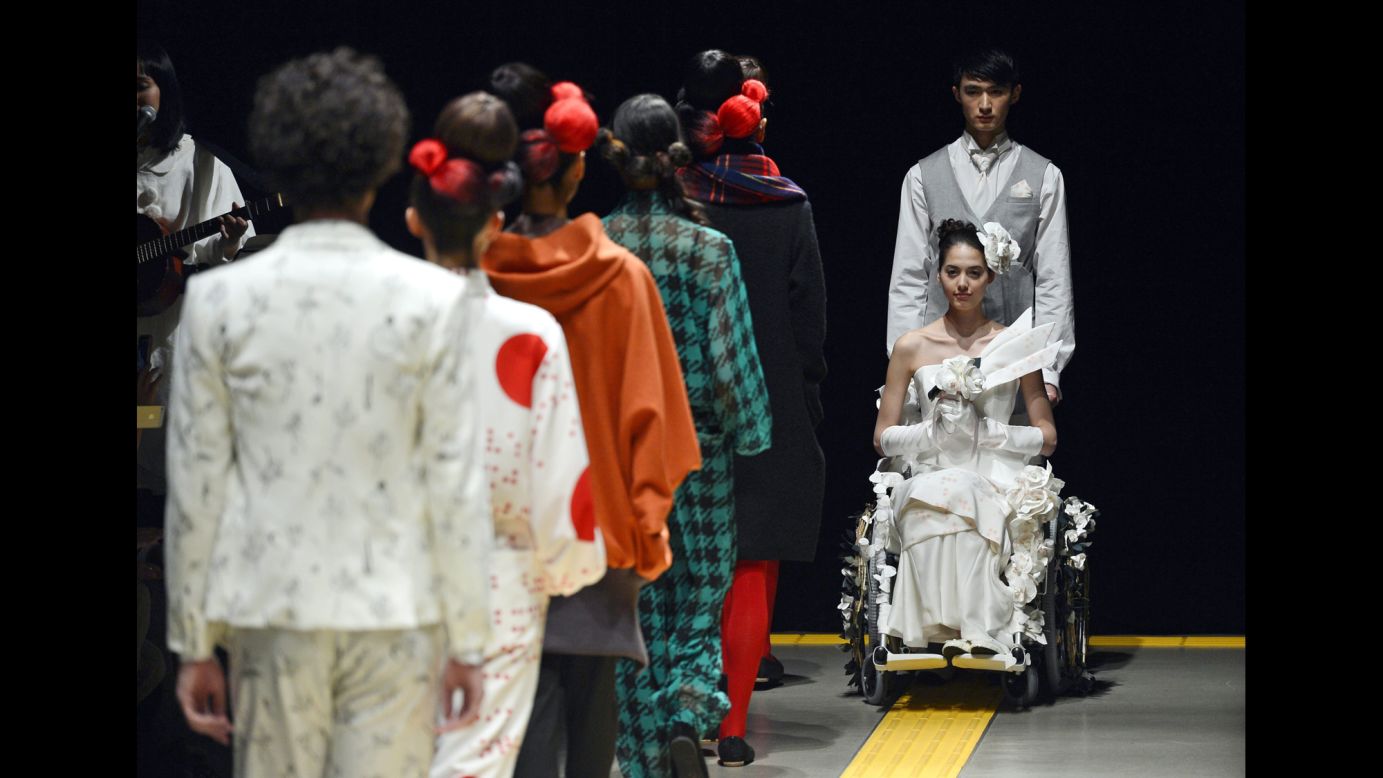Models present creations by Japanese designer Takafumi Tsuruta for the fashion label ha ha on Tuesday, March 18, during Mercedes-Benz Fashion Week in Tokyo.