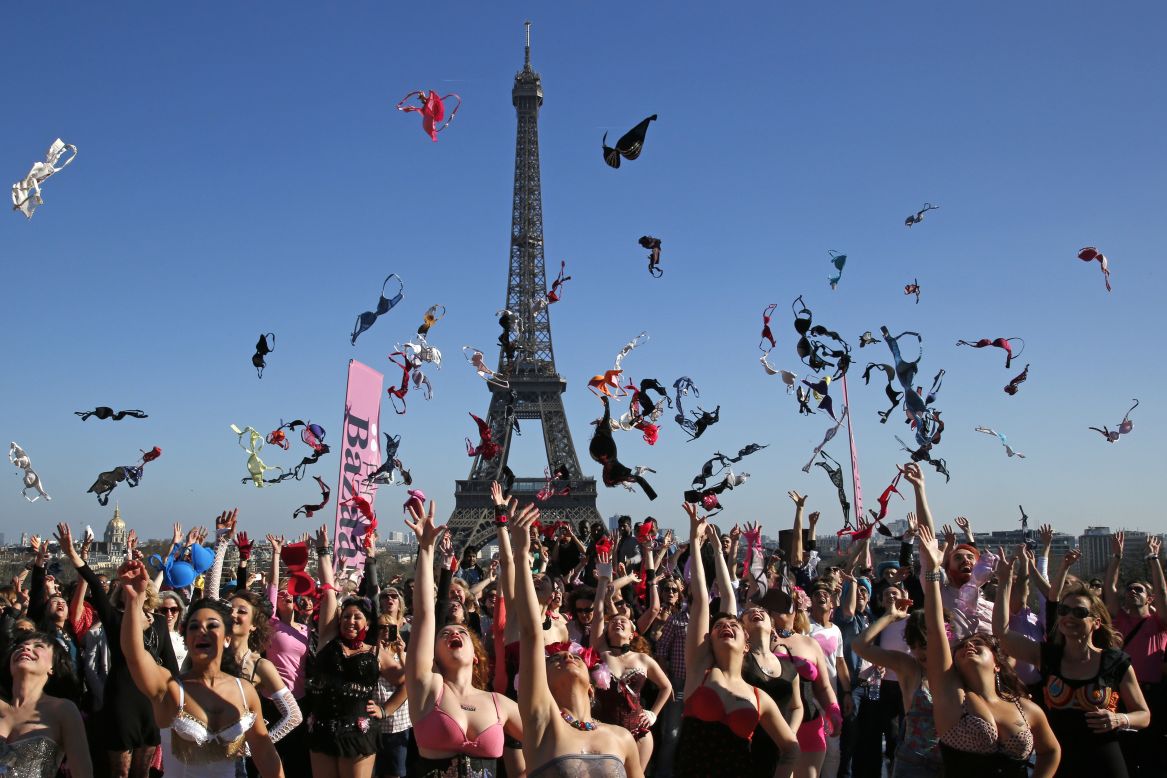 Women toss bras in the air near the Eiffel Tower in Paris on Sunday, March 16. It was part of an annual charity event to promote breast cancer awareness.