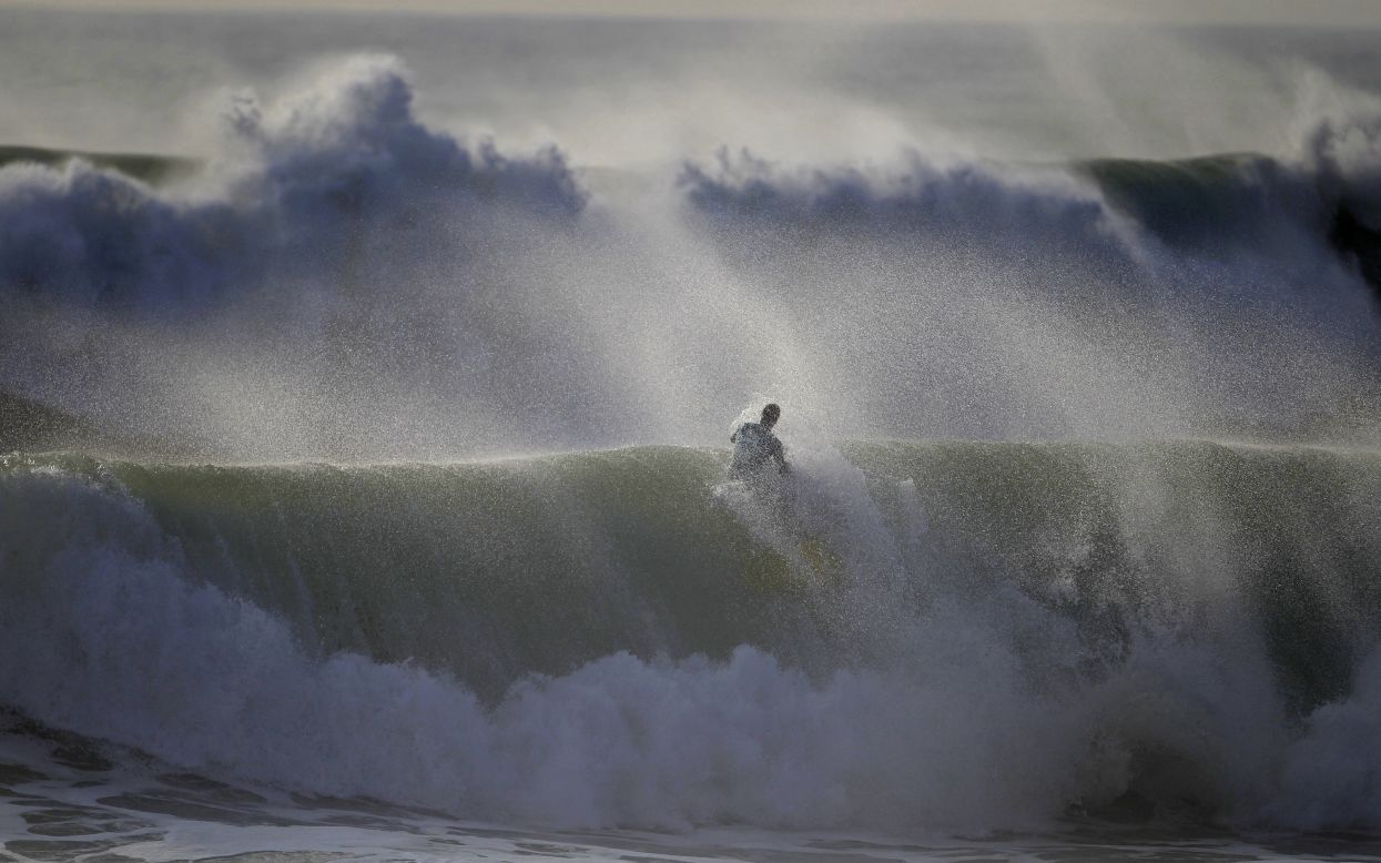 A bodyboarder rides a wave during Sumol Nazare Special Edition competition in Nazare, Portugal, on Wednesday, March 19. The event started 10 years ago and gathers bodyboarders from different countries.