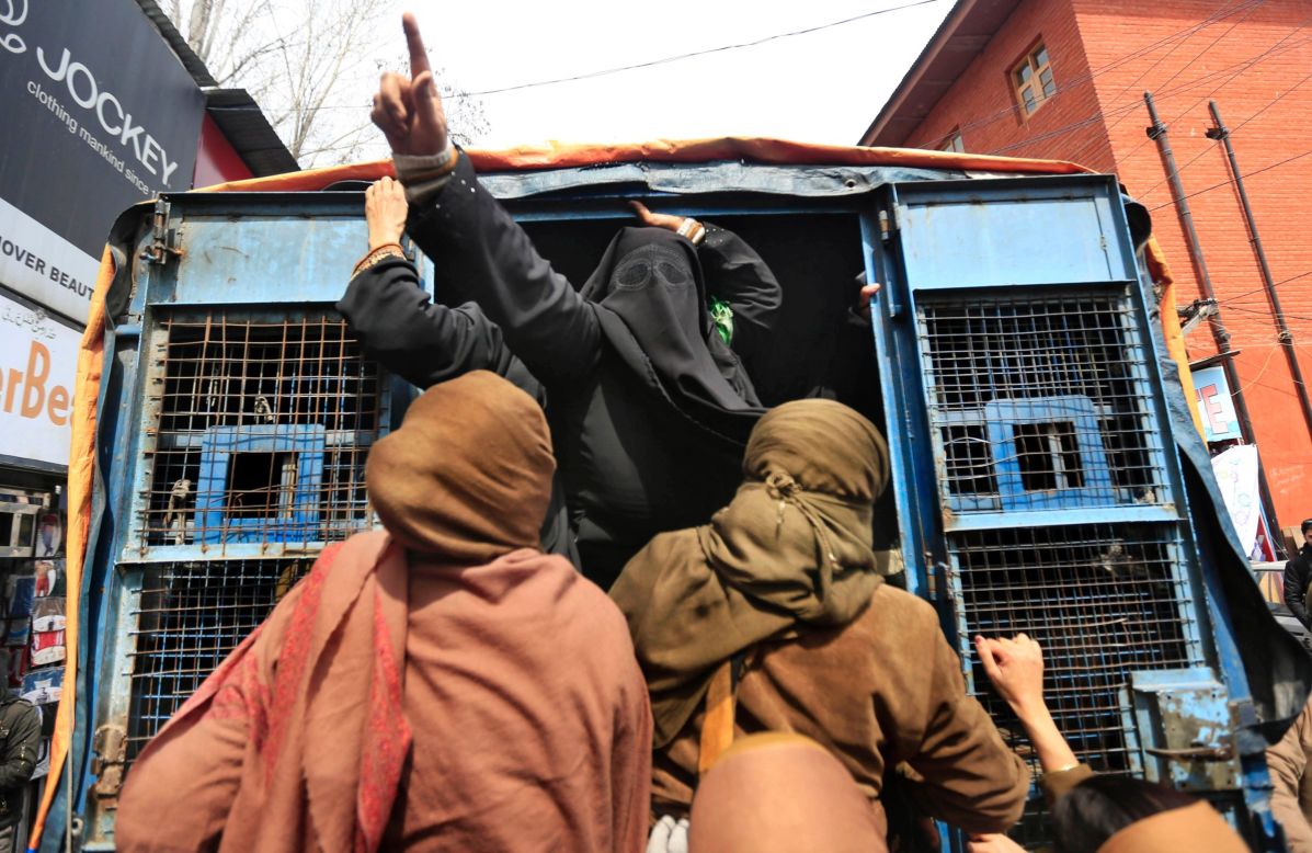 A member of the Jammu Kashmir Mass Movement shouts slogans from a police van after being detained during a protest in Srinagar, India, on Thursday, March 20. <a href="http://www.cnn.com/2014/03/14/world/gallery/week-in-photos-0314/index.html">See last week in 26 photos.</a>