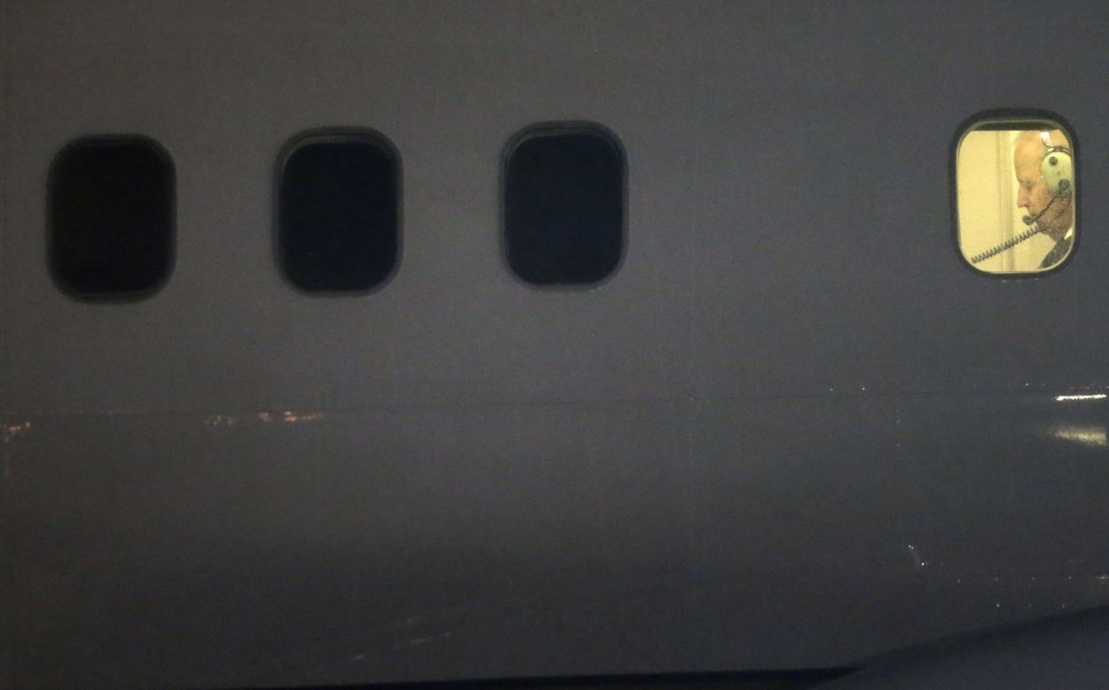 U.S. Vice President Joe Biden is seen in a plane window after landing in Vilnius, Lithuania, on Tuesday, March 18.