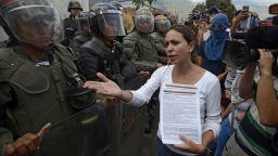 Opposition deputy Maria Corina Machado talks to members of the National Guard during a protest against Venezuelan President Nicolas Maduro, in Caracas on March 16, 2014.