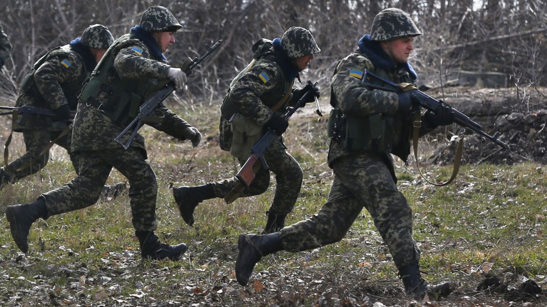 Ukrainian border guards run during training at a military camp in Alekseyevka, Ukraine, on March 21.