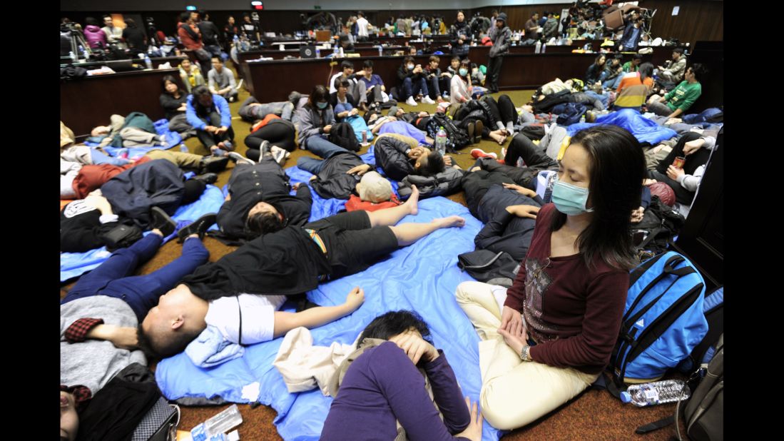 More than 200 people, mostly students, occupy Taiwan's Parliament building in Taipei on Friday, March 21.