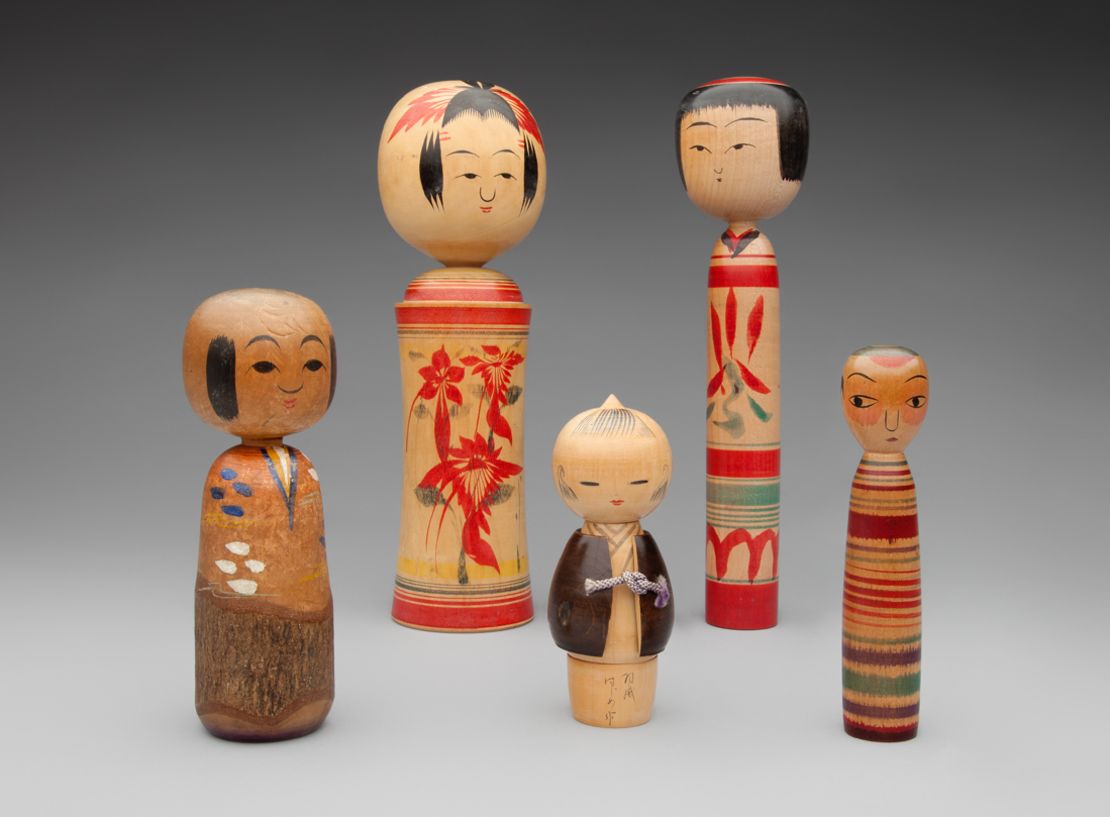 Kokeshi dolls are characterized by lack of arms and legs and  brightly painted floral or geometric designs.