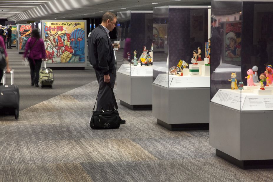 Astro Boy captures the attention of an SFO Terminal 3 traveler. Museum exhibits are becoming the norm at many U.S. airports, but San Francisco's is the only one accredited by the American Alliance of Museums.