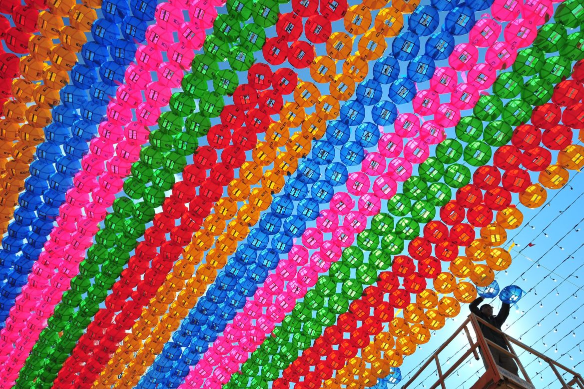 MARCH 21 - SEOUL, SOUTH KOREA: A worker sets up lotus lanterns at the Jogyesa Temple ahead of celebrations marking the Buddha's birthday on May 6. Buddhism is one of the country's largest and most active religions. Although the exact date is unknown, the Buddha's official birthday is celebrated on April 8 of South Korea's lunar calendar.