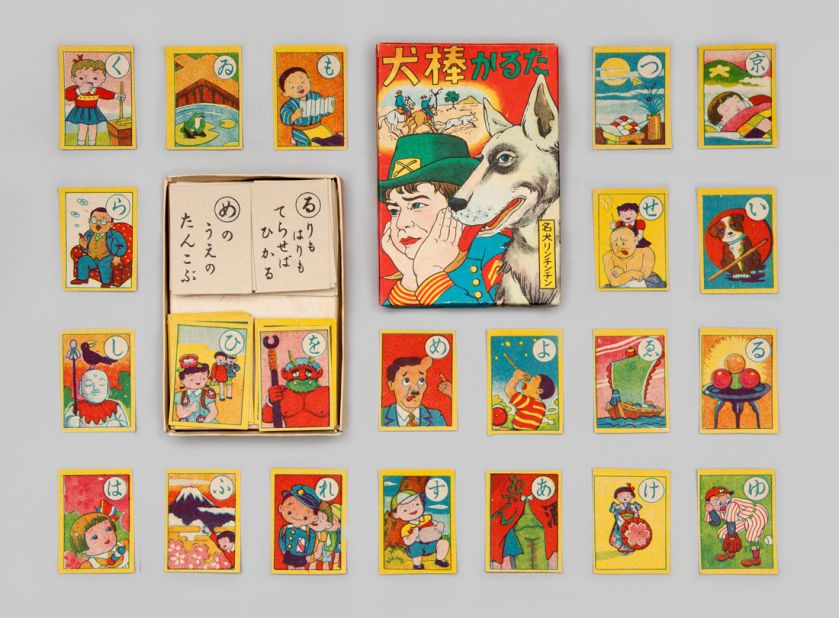 Karuta cards were used to play a traditional game. In one version, a person reads a poem or well-known proverb. The first player who identifies the card with the corresponding character wins the card.
