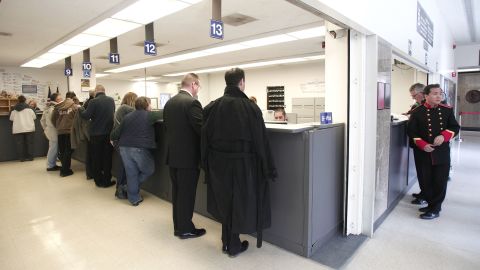 Same-sex couples get their marriage licenses at the Oakland County Courthouse in Pontiac, Michigan, on March 22, 2014, a day after a federal judge overturned Michigan's ban on same-sex marriage.