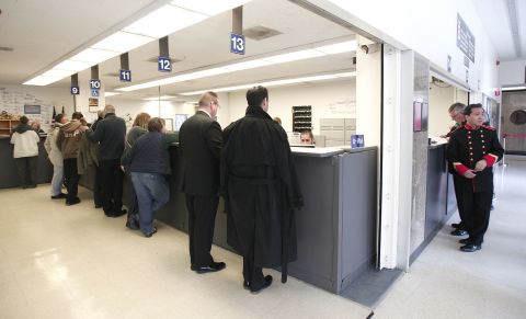 Same-sex couples get their marriage licenses at the Oakland County Courthouse in Pontiac, Michigan, on March 22, 2014, a day after a federal judge overturned Michigan's ban on same-sex marriage.