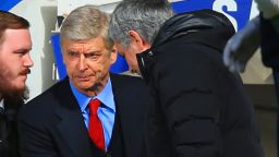 Arsenal boss Arsene Wenger (left) and Jose Mourniho share a frosty handshake before kick-off at Stamford Bridge.