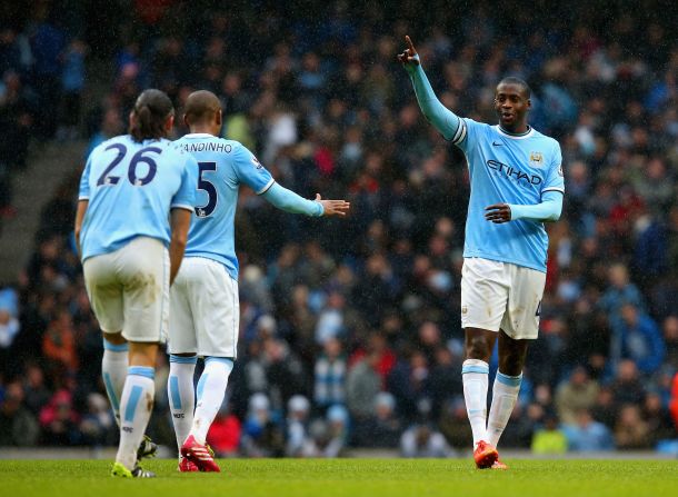 Yaya Toure (right) scored a hat-trick as Manchester City beat Fulham 5-0 at the Etihad Stadium. The Sky Blues' other goals came from Fernandinho and Martin Demichelis (both pictured). 