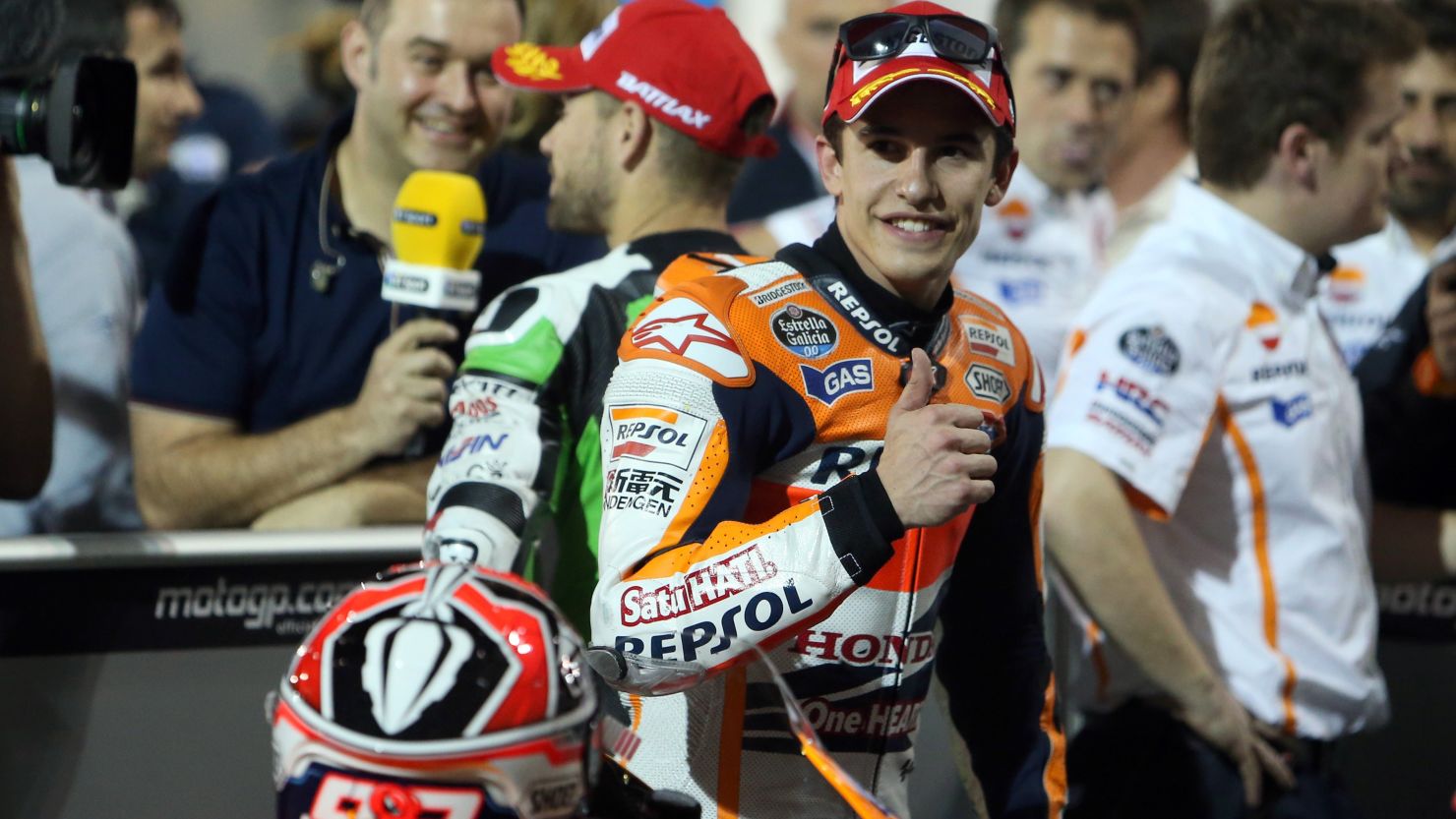 Marc Marquez gives the thumbs up after securing pole for the opening race of the MotoGP season in Qatar.