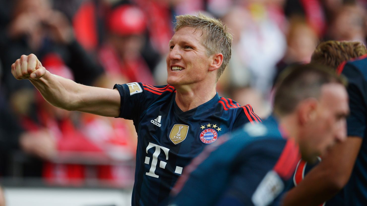 Bastian Schweinsteiger punches the air in relief and delight after scoring a late goal against Mainz. 