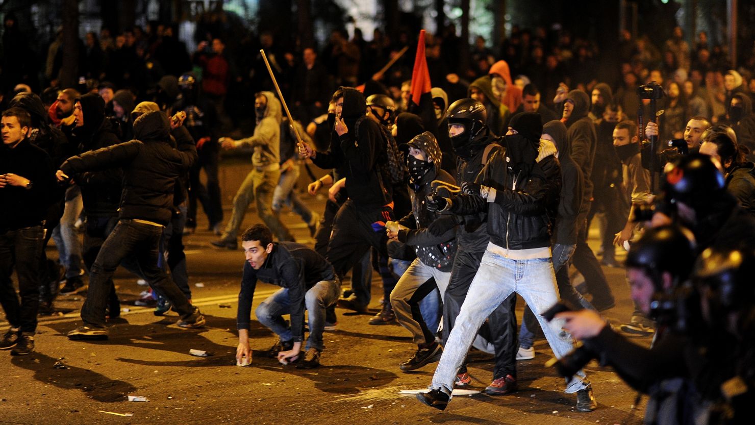 Demonstrators confront police in Madrid as an anti-austerity protest ends in clashes.
