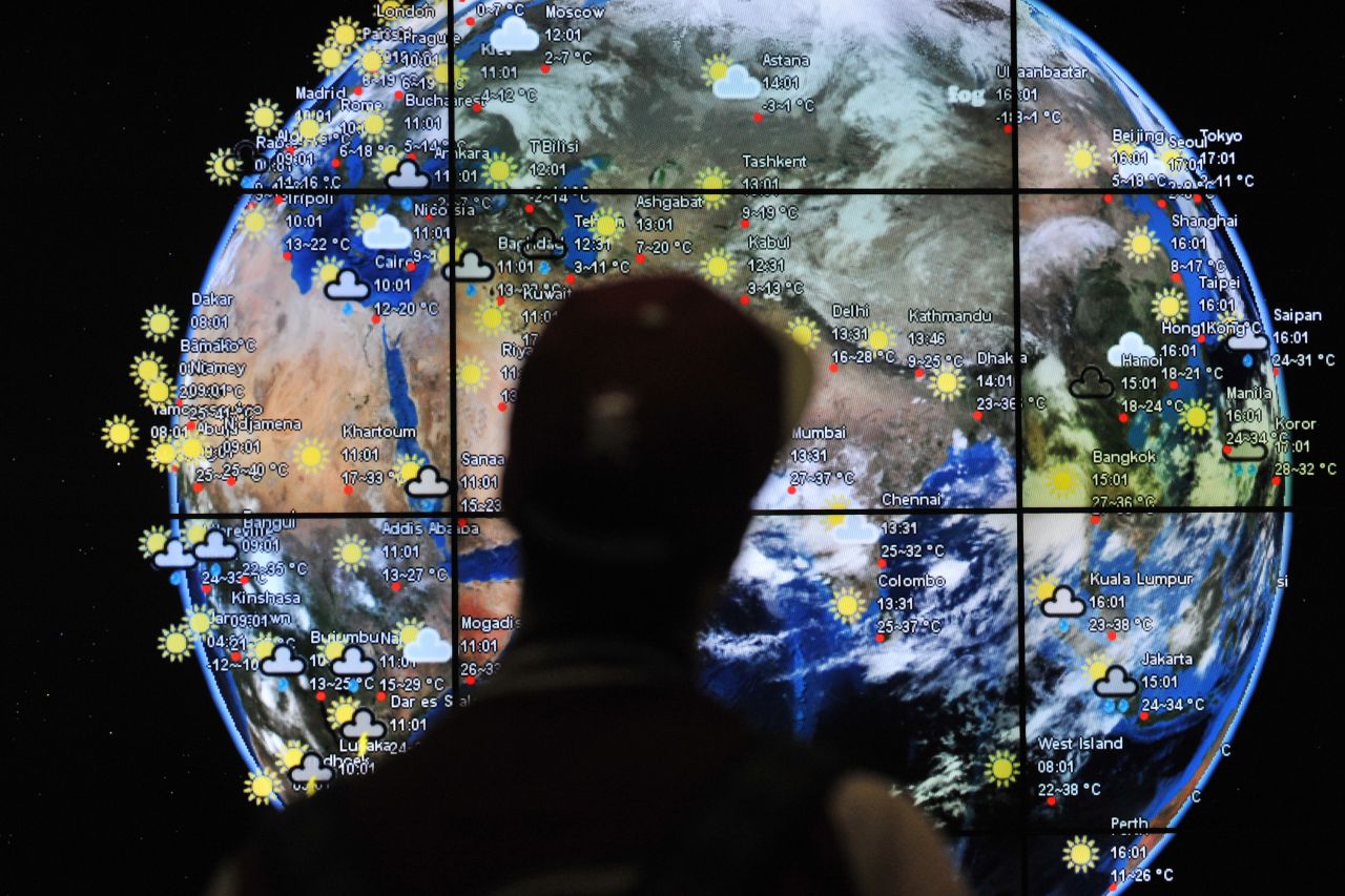 A passenger views a weather map in the departures terminal of Kuala Lumpur International Airport on March 22, 2014.