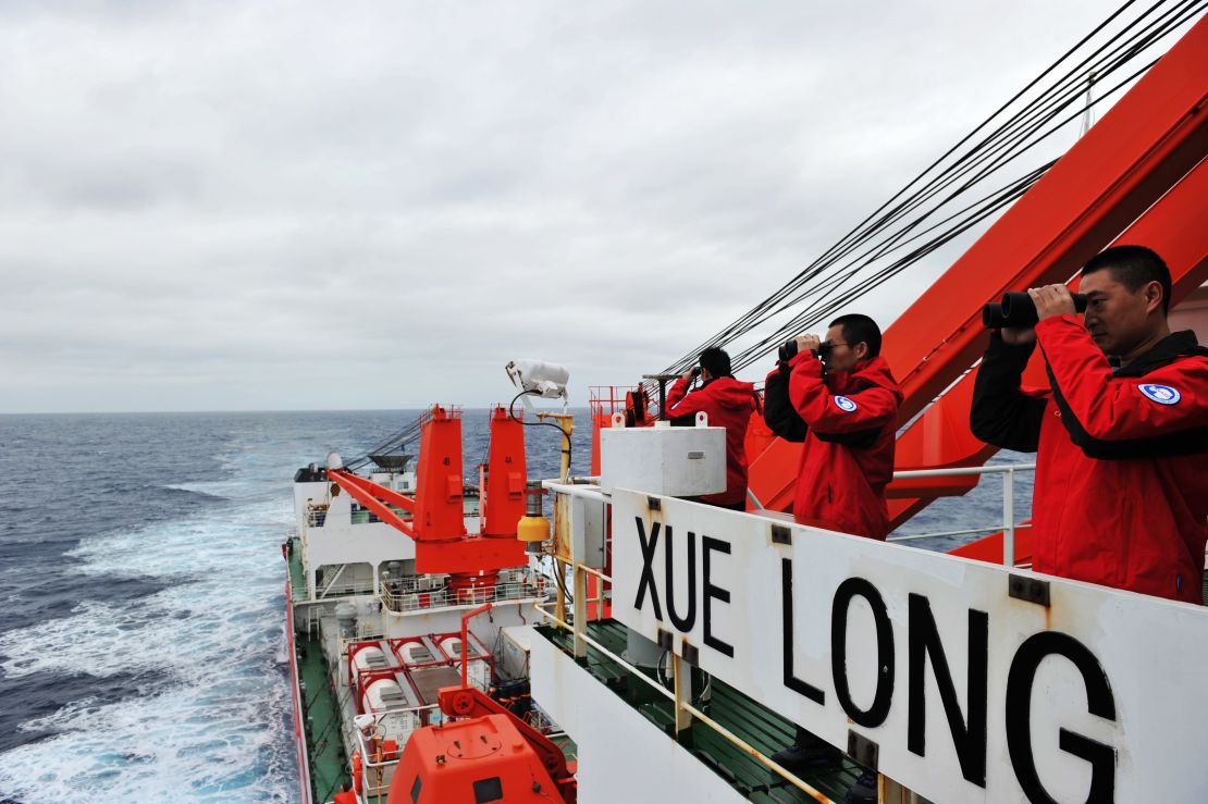 Crew members on search duty on board the Chinese icebreaker Xuelong on March 23, 2014.