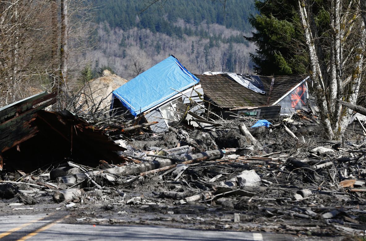 A destroyed home is stranded atop mud and debris on State Route 530 near Oso on March 23.