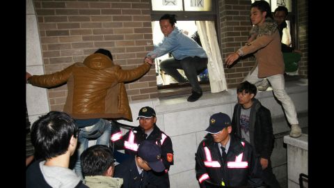 Protesters storm government buildings in Taipei on March 24.