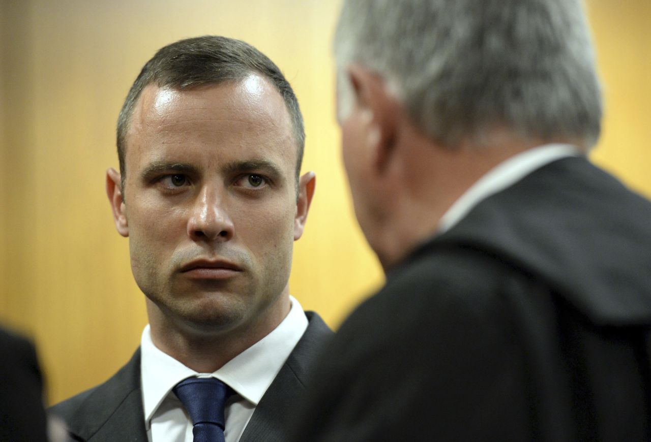 Pistorius talks to defense attorney Barry Roux on March 24. 
