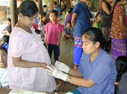 Malaria testing at Mae La refugee camp, Northwest Thailand. - (Courtesy Shoklo Malaria Research Unit.)