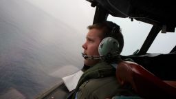 Image #: 28282552    epa04138821 Co-Pilot, Flying Officer Marc Smith turns his RAAF AP-3C Orion aircraft at low level in bad weather whilst searching for missing Malaysia Airways Flight MH370 at sea off Australia, 24 March 2014. The search is being conducted in an area 2,500km off the South West coast of Perth after the Malaysian Airways aircraft went missing on 08 March whilst on a flight between Kuala Lumpur and Beijing. An Australian surveillance aircraft on 24 March spotted two objects in the southern Indian Ocean that could be related to the missing Malaysian jet, raising hope of locating the aircraft after more than two weeks of search. Ten aircraft in total are scouring a 59,000-square-kilometre patch of sea between Australia and Antarctica for a clue that could lead to the location of the missing plane.  RICHARD WAINWRIGHT/EPA/LANDOV