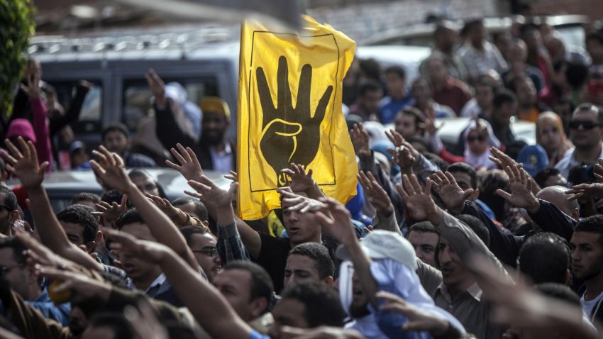 Muslim Brotherhood and ousted President Mohamed Morsi supporters shout slogans during during a demonstration in Cairo on November 29, 2013.