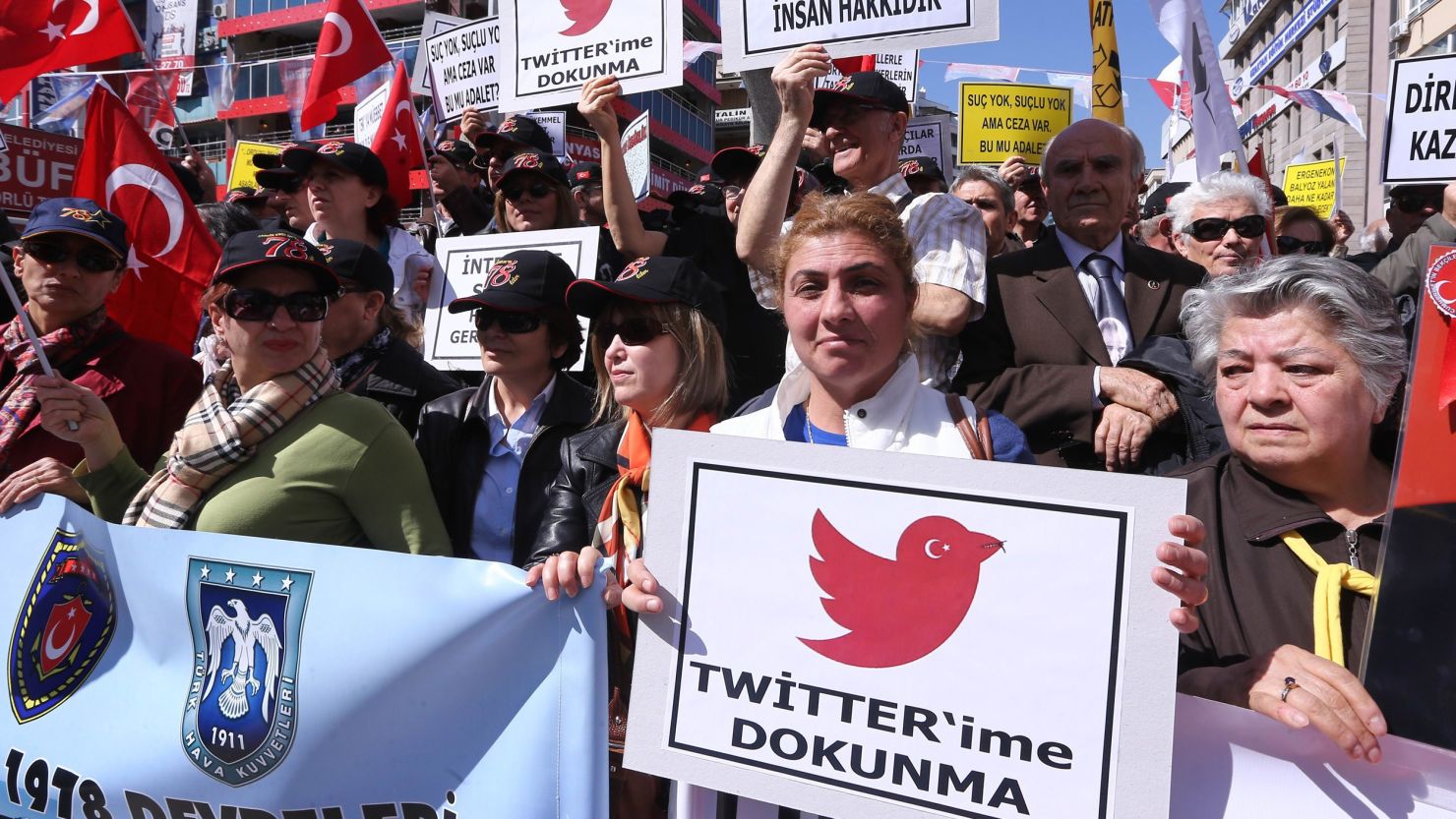 Protesters hold placards reading "Do not touch my Twitter" during a protest against the Turkish government's Twitter ban.
