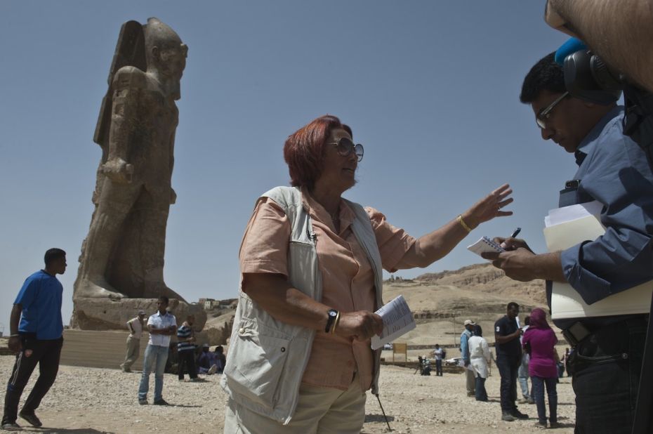 German archaeologist Hourig Sourouzian, who heads the project to conserve the Amenhotep III temple, speaks to media in front of one of the two newly displayed statues. The statues were restored after being discovered in pieces during excavations at the site. 