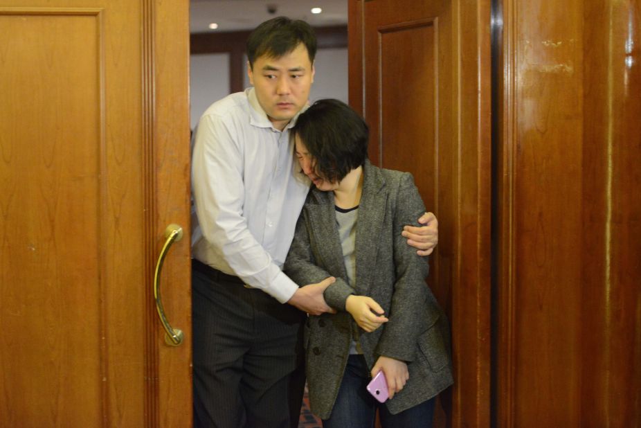 Grieving relatives of missing passengers leave a hotel in Beijing on March 24, 2014.