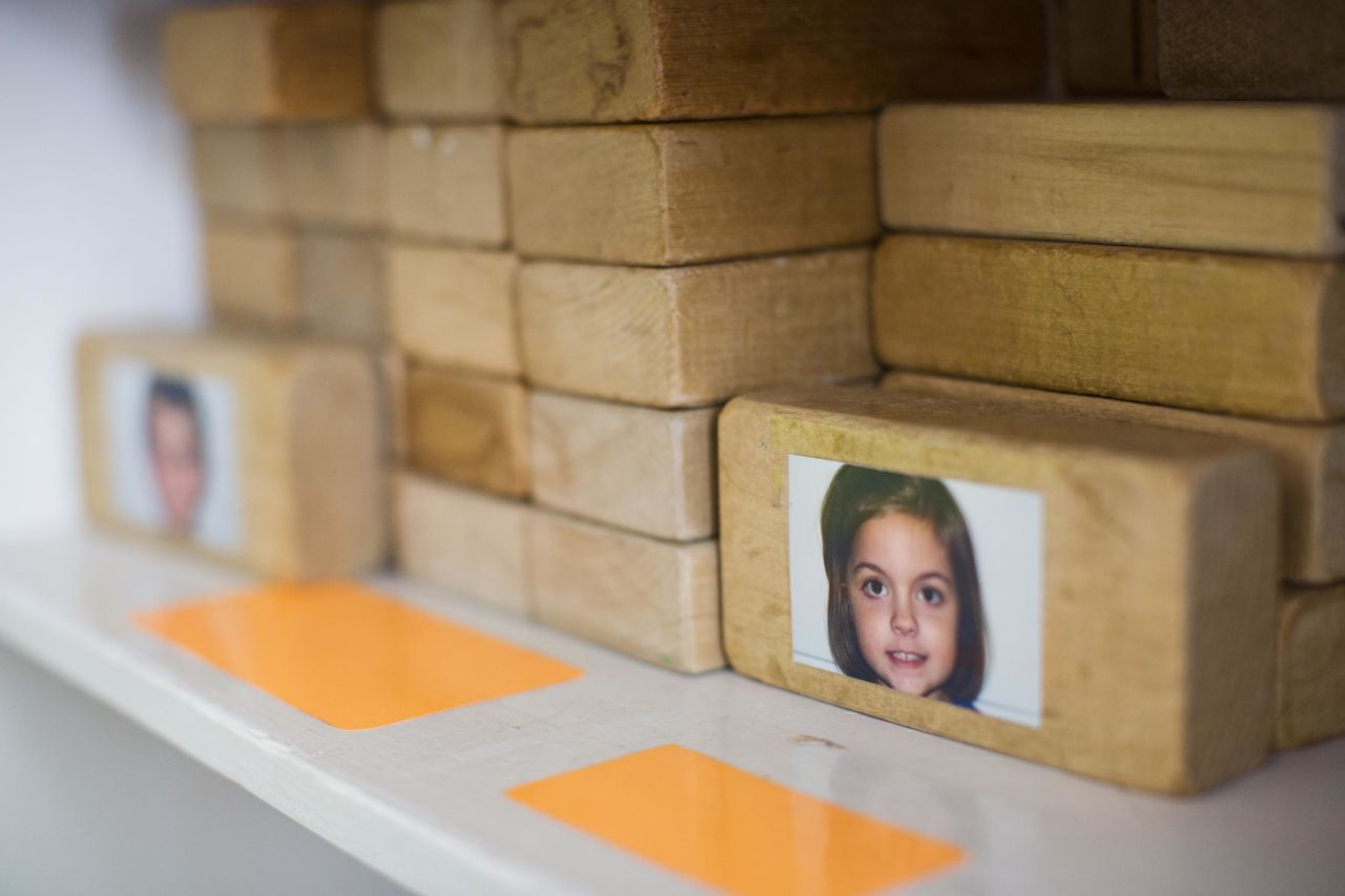 Some younger students at Hess Academy use blocks with their photos on them, sometimes for charting activities and answering daily questions, and sometimes just for building.