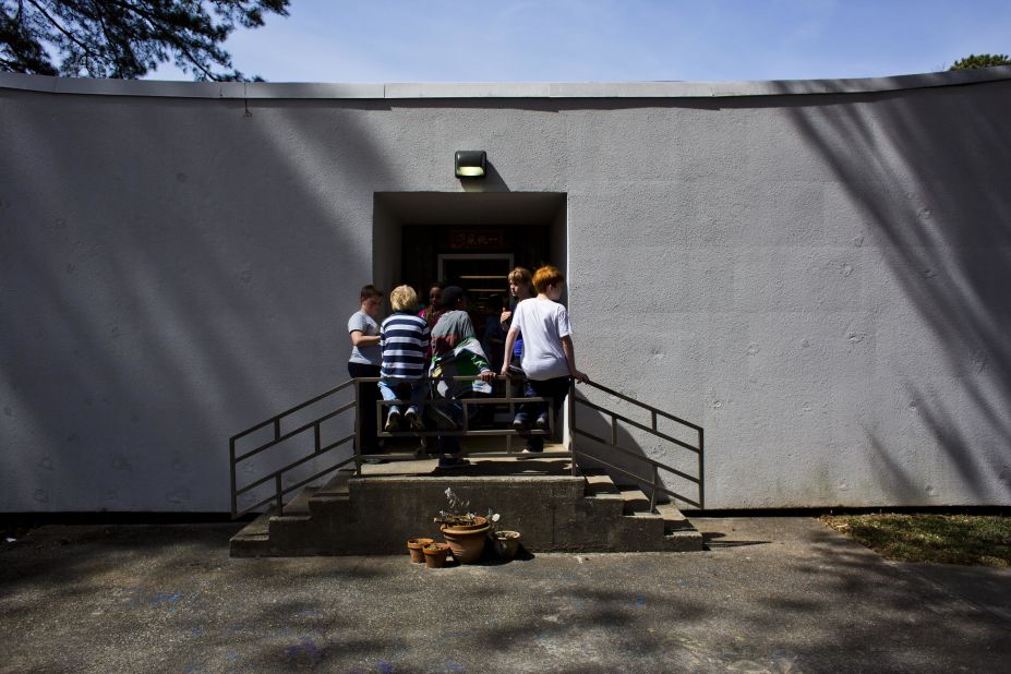 Students wait to go back inside from the playground at Hess Academy.