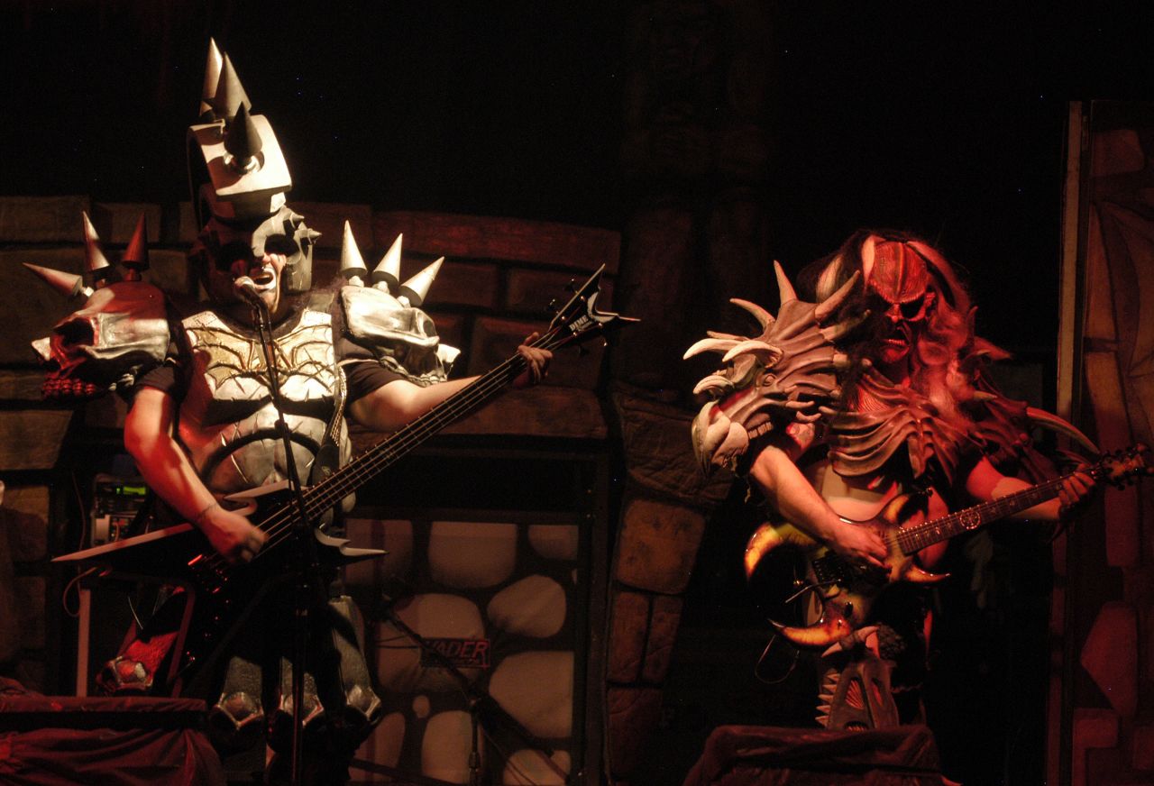 Bassist Jamison Land performs as Beefcake the Mighty, left, alongside lead guitarist Cory Smoot, or Flattus Maximus. While on tour in November 2011, Smoot died of a coronary artery thrombosis brought on by a heart condition, the coroner said. He was 34.