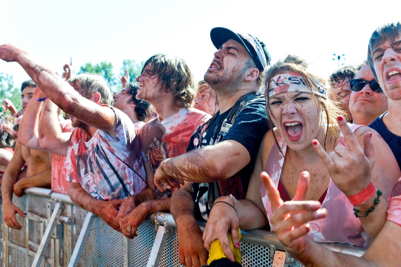 Devoted fans revel in the opportunity to be covered in fake blood at a Gwar performance.