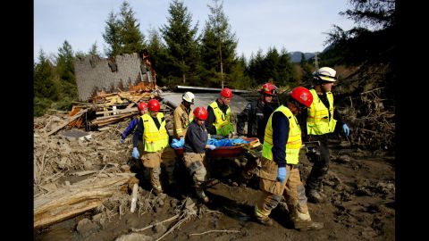 A search-and-rescue team carries the body of a victim on March 24.