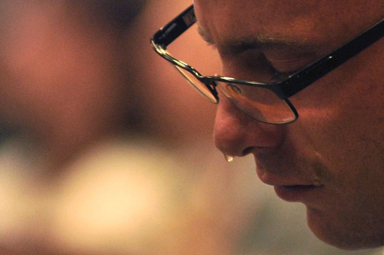 Pistorius cries as he sits in the dock during his trial on Monday, March 24.