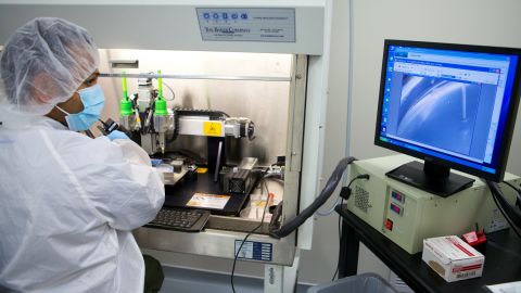 One of Organovo's engineers oversees the construction of a vascular tissue construct on a NovoGen MMX bioprinter.
