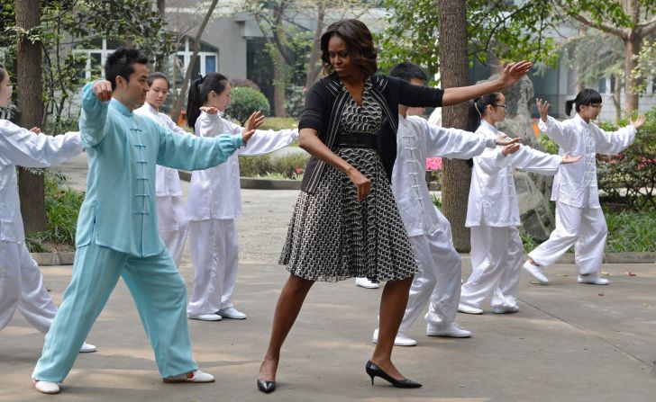 Michelle tries her hand at tai chi, while visiting a high school in Chengdu. 