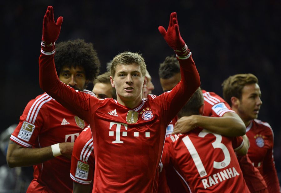 Toni Kroos (center) celebrates scoring Bayern Munich's opening goal against Hertha Berlin which helped seal a 24th Bundesliga title for the Bavarians. 