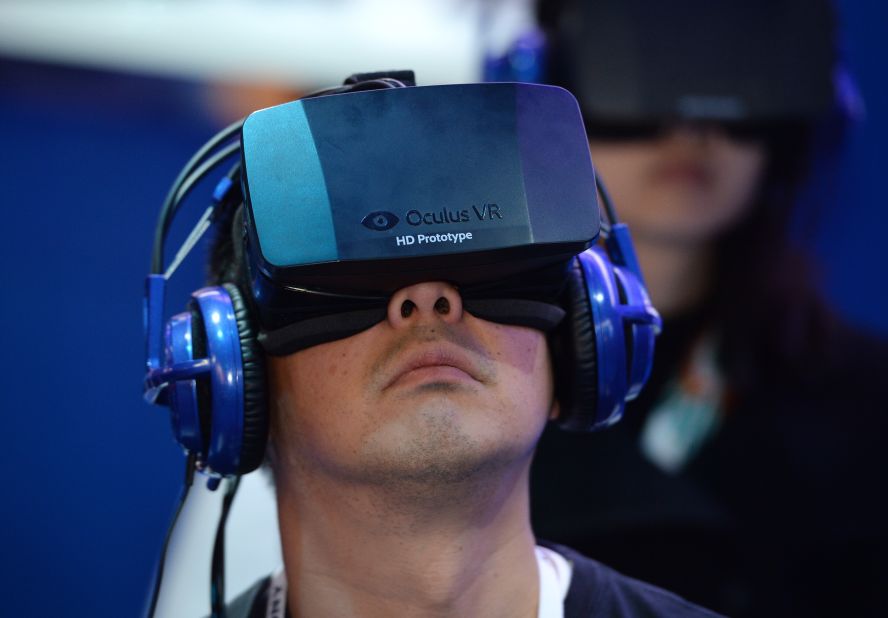 An attendee demos an Oculus Rift HD virtual-reality headset while playing a shooter game at the Consumer Electronics Show (CES) in January.