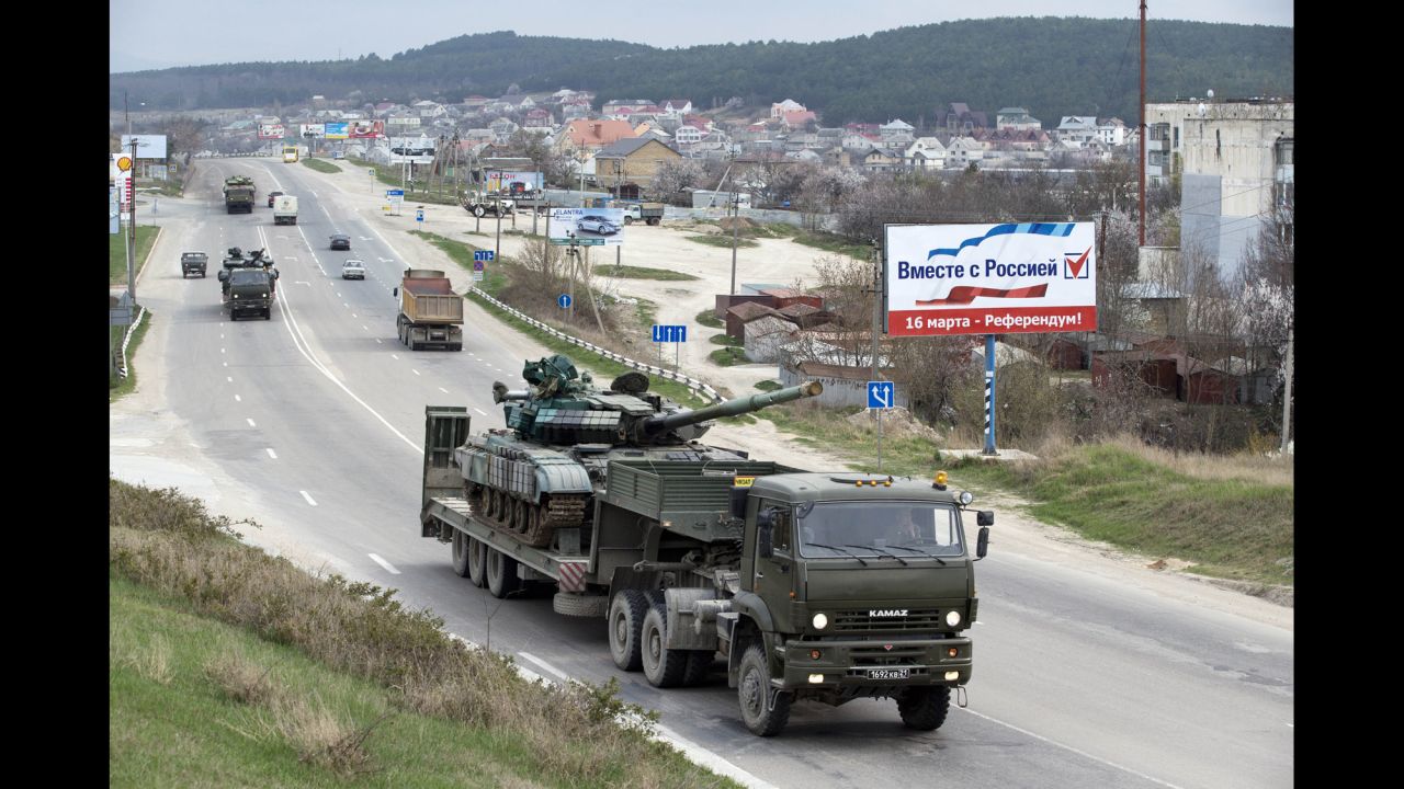 Ukrainian tanks are transported from their base in Perevalne, Crimea, on Wednesday, March 26. After Russian troops seized most of Ukraine's bases in Crimea, interim Ukrainian President Oleksandr Turchynov ordered the withdrawal of armed forces from the peninsula, citing Russian threats to the lives of military staff and their families.