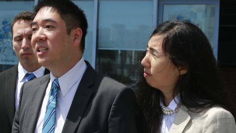 Matthew and Grace Huang speak to the press outside the Court of First Instance before their trial in Doha, Qatar on March 27.