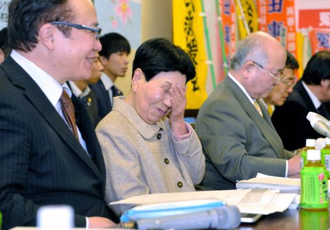 Hideko Hakamada, center, sheds tears of joy after the court ruling.