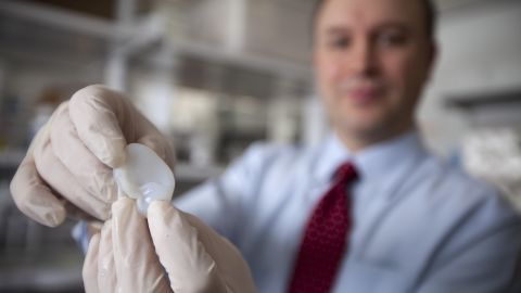 Lawrence Bonassar, a professor of biomedical engineering at Cornell University, with an artificial ear made via 3-D printing and injectable molds.