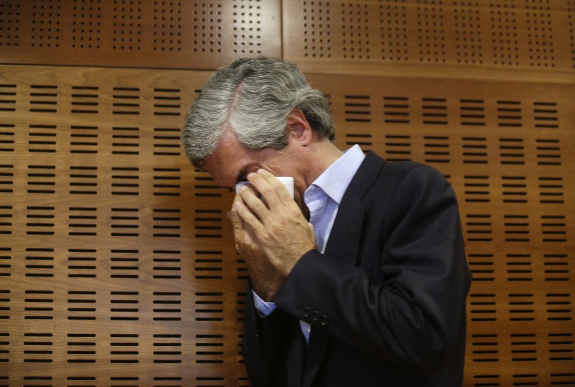 Adolfo Suarez Illana, son of former Spanish Prime Minister Adolfo Suarez, cries after announcing the imminent death of his father Friday, March 21, in Madrid.