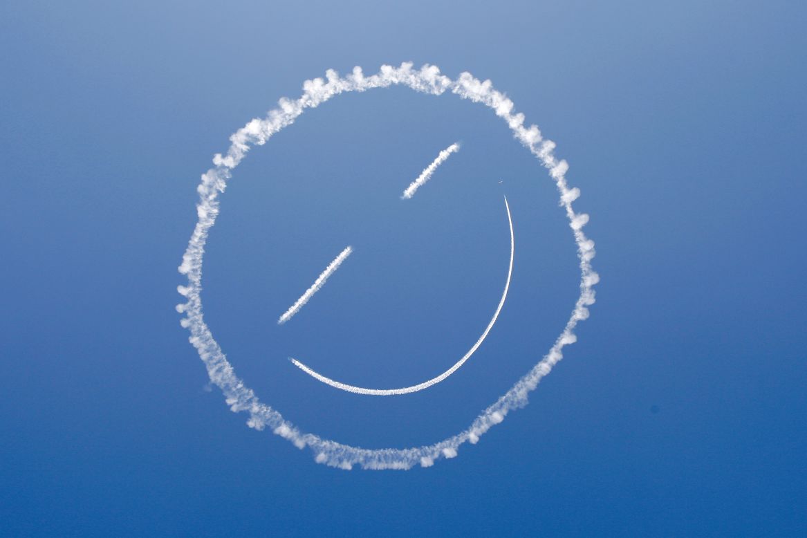 A skywriter draws a smiley face at the start of the Los Angeles County Air Show that was held Friday, March 21, in Lancaster, California.