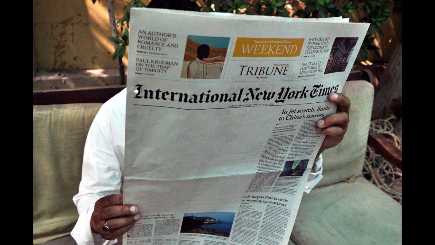 A man reads a copy of the International New York Times at an office in Karachi, Pakistan, on Monday, March 24. <a href="http://www.nytimes.com/2014/03/23/business/media/times-report-on-al-qaeda-is-censored-in-pakistan.html" target="_blank" target="_blank">The New York Times says</a> an article about Pakistan's relationship to al Qaeda was censored by its local distributor in the country, leaving a blank space on its weekend edition.